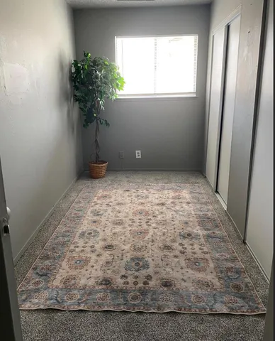 a view of room with window and tree