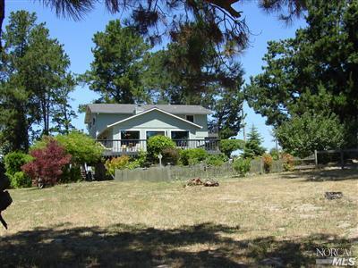 1510 Schaeffer Road Sebastopol, CA 95472 - Photo 2 of 12 a front view of a house with a yard