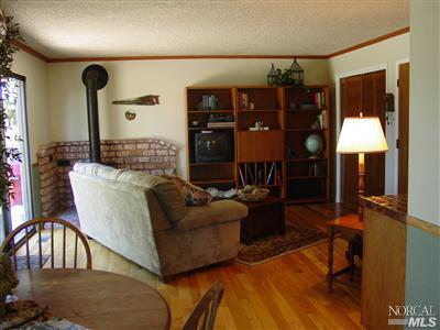 1510 Schaeffer Road Sebastopol, CA 95472 - Photo 3 of 12 a living room with furniture and a wooden floor