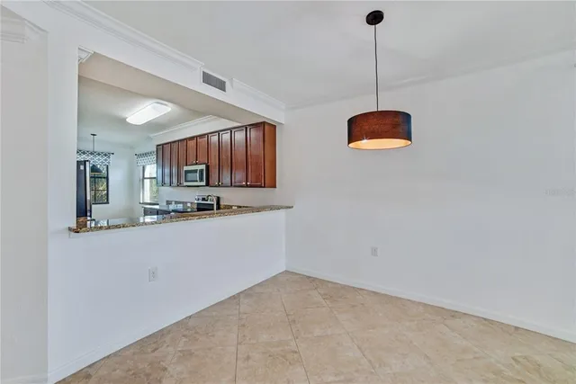 a kitchen with stainless steel appliances granite countertop wooden cabinets a sink and dishwasher
