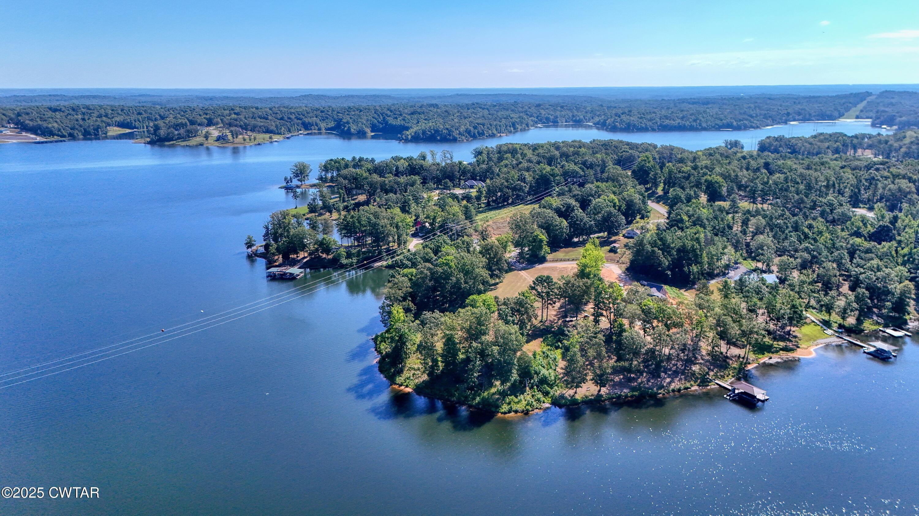 0 Kyle Road Huntingdon, TN 38344 - Photo 4 of 10 an aerial view of a houses with a lake view