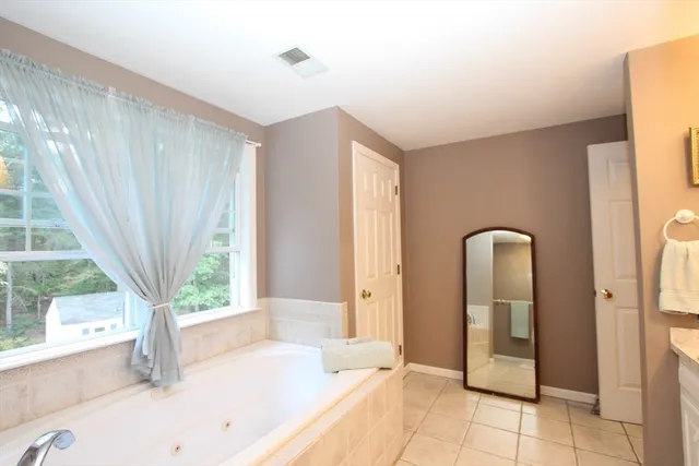 a bathroom with a bathtub and a sink