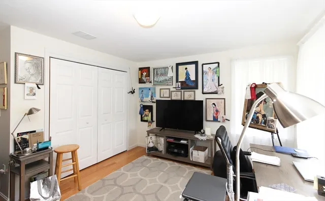 a view of a workspace with furniture and a living room