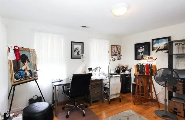 a view of a workspace with furniture and toys