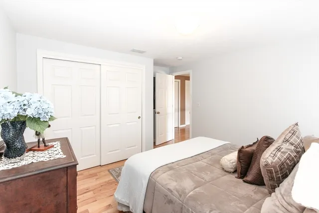 a bedroom with a bed and a table