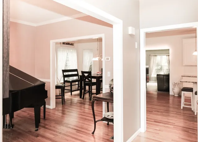 a view of a livingroom with furniture and wooden floor