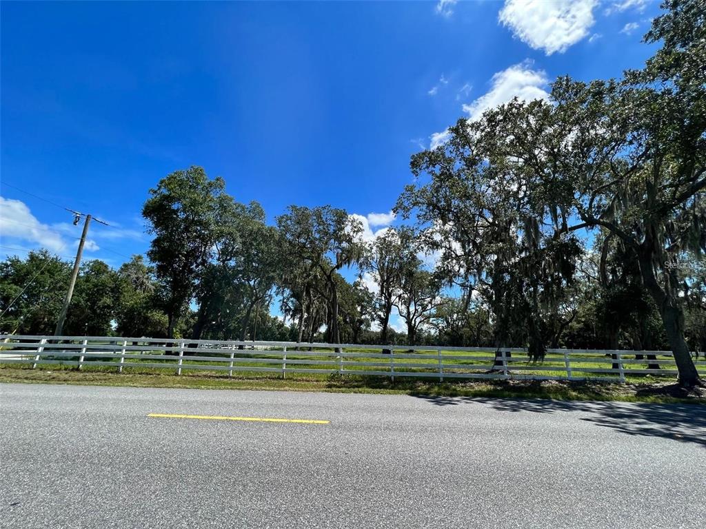 Simmons Road Kissimmee, FL 34744 - Photo 2 of 10 a view of a swimming pool with a house in the background