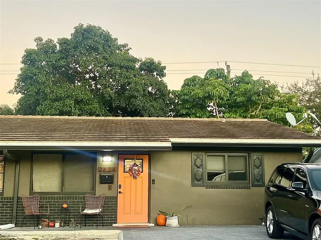 a view of outdoor space and car parked in the road