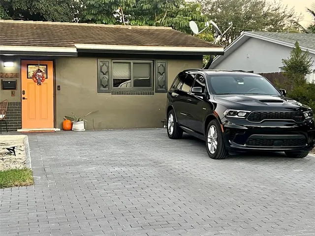 a car parked in front of a house