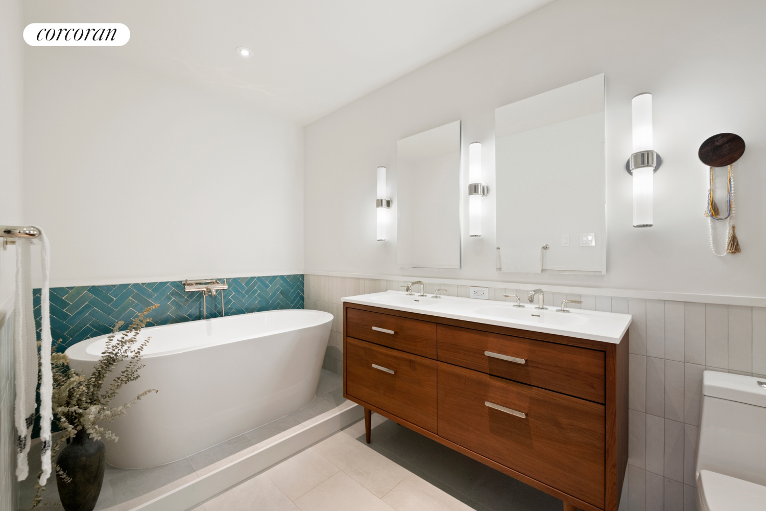 130 Fulton Street, Unit 12A Manhattan, NY 10038 - Photo 10 of 17 a bathroom with a tub sink and mirror