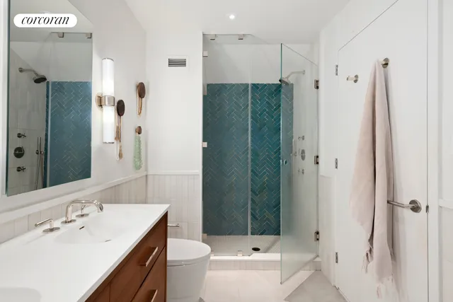 a view of hallway with cabinets and furniture