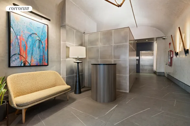 a bathroom with a sink mirror and a toilet