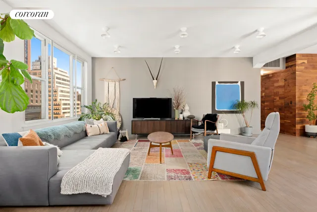 a living room with furniture and windows