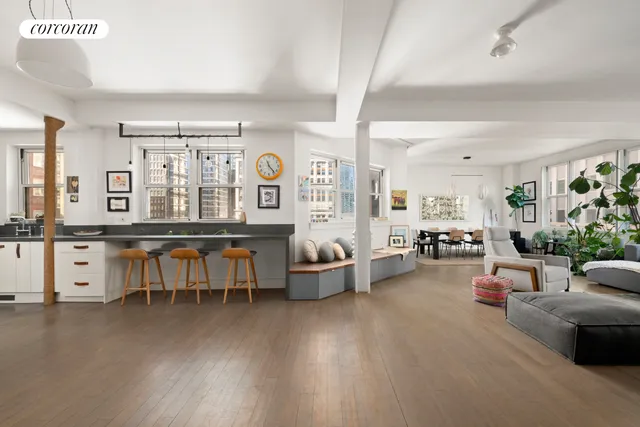 a kitchen with a table chairs and a stove in it