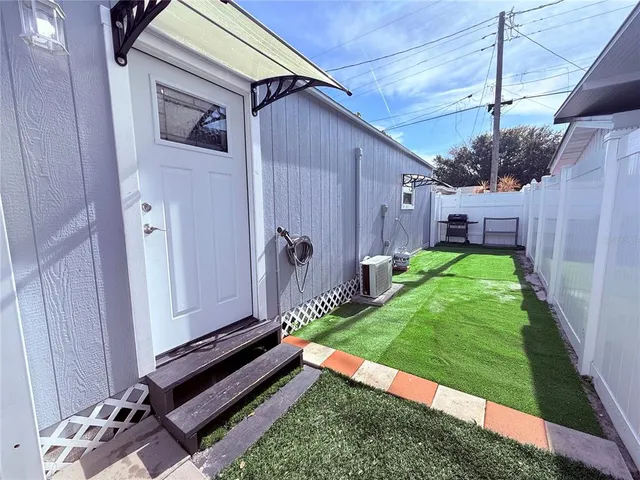 a backyard of a house with garden and patio