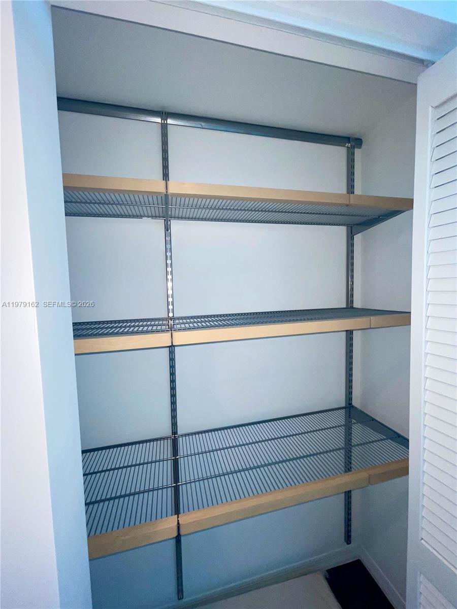 951 Brickell Avenue, Unit 3211 Miami, FL 33131 - Photo 18 of 35 a view of walk in closet