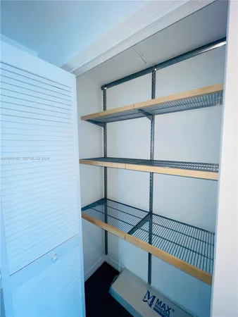 a room with a bed and a window