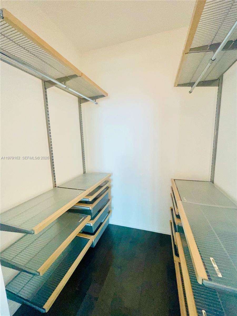 951 Brickell Avenue, Unit 3211 Miami, FL 33131 - Photo 20 of 35 a room with a bed and a window
