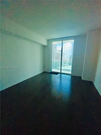 a kitchen with granite countertop a refrigerator and a stove