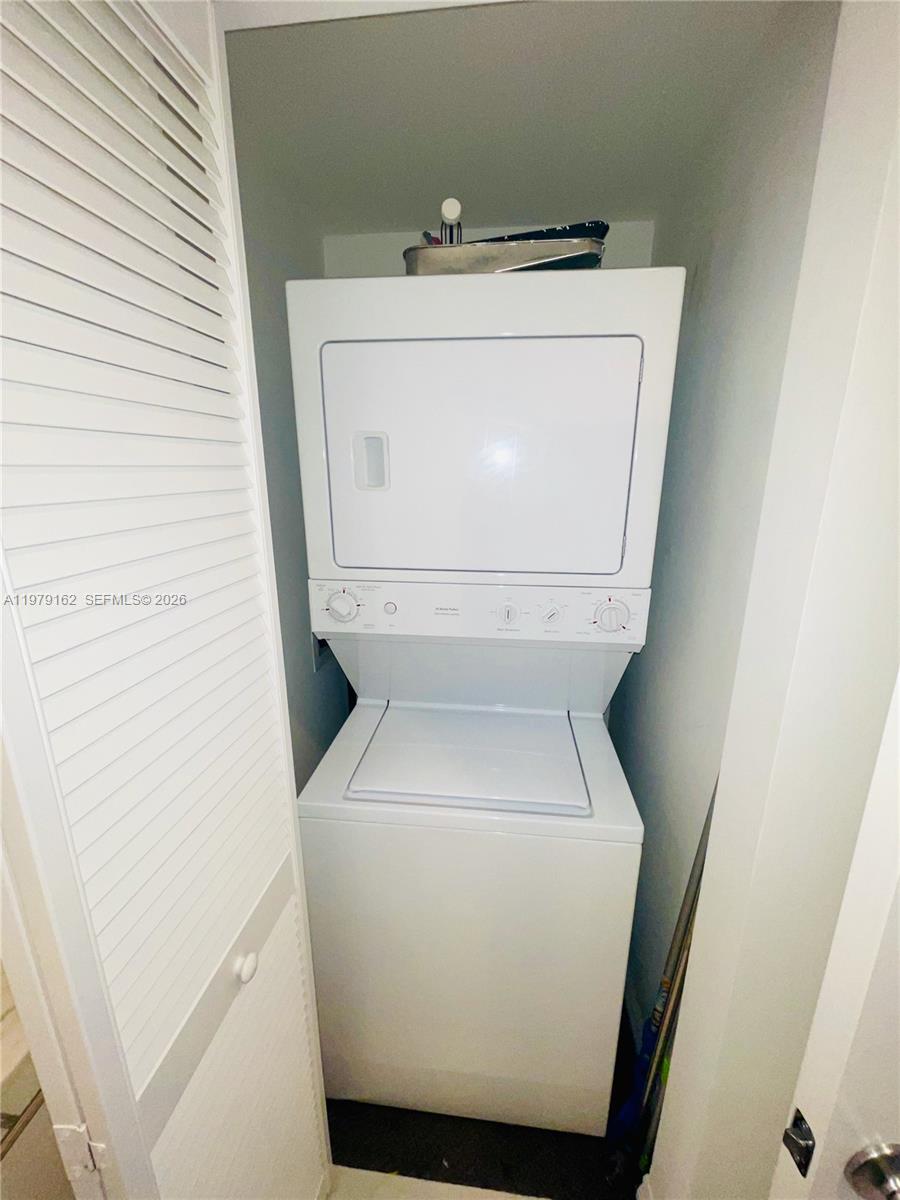 951 Brickell Avenue, Unit 3211 Miami, FL 33131 - Photo 25 of 35 a close up view of a washer and dryer