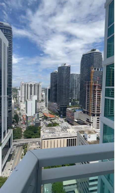 951 Brickell Avenue, Unit 3211 Miami, FL 33131 - Photo 35 of 35 a view of a patio with swimming pool and sitting area