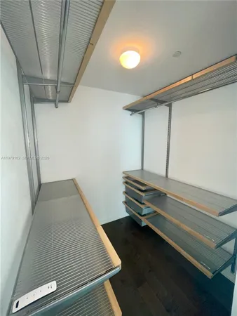 a room with stairs and a rug