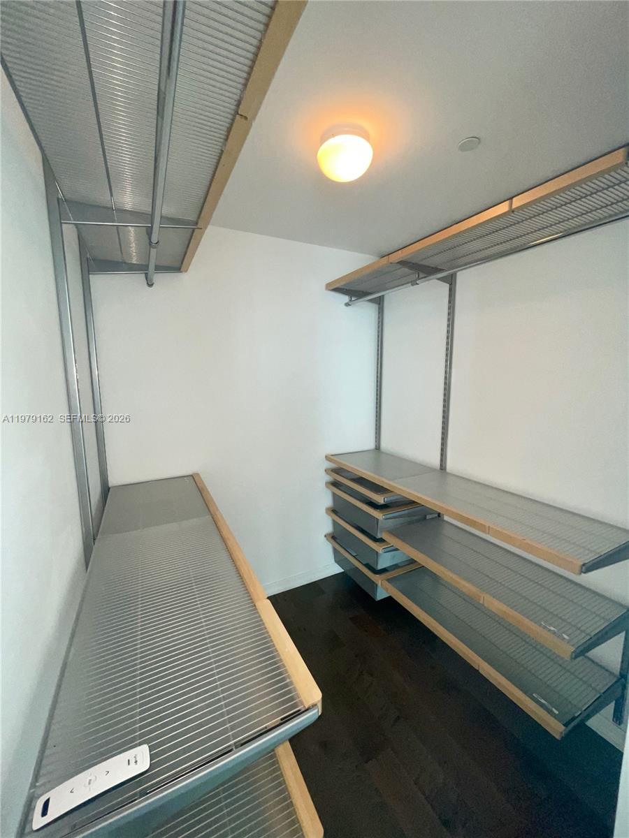 951 Brickell Avenue, Unit 3211 Miami, FL 33131 - Photo 10 of 35 a room with stairs and a rug