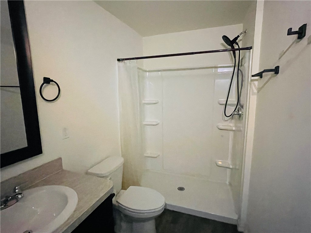 1281 Barber Street Sebastian, FL 32958 - Photo 13 of 26 a bathroom with a granite countertop sink toilet and shower