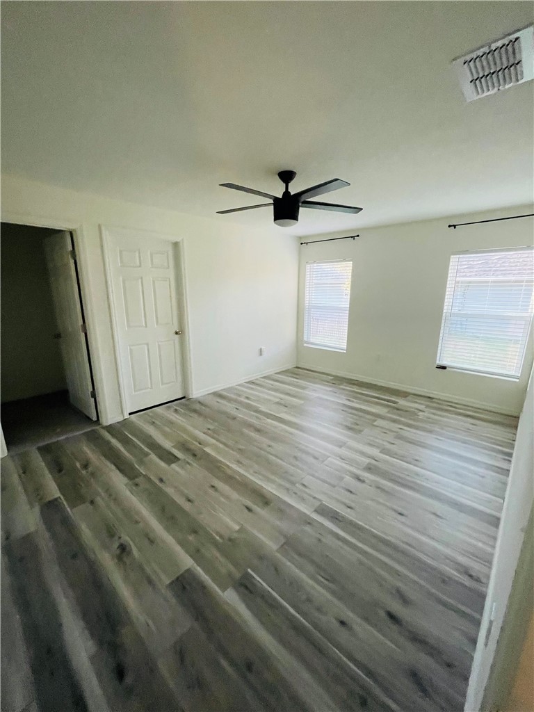 1281 Barber Street Sebastian, FL 32958 - Photo 14 of 26 a view of empty room with wooden floor and ceiling fan