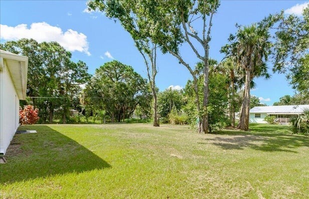 1281 Barber Street Sebastian, FL 32958 - Photo 21 of 26 a backyard of a house with lots of green space