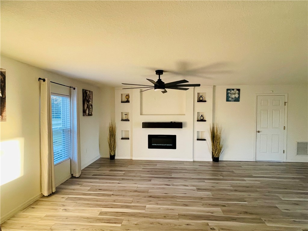 1281 Barber Street Sebastian, FL 32958 - Photo 4 of 26 a view of a livingroom with wooden floor