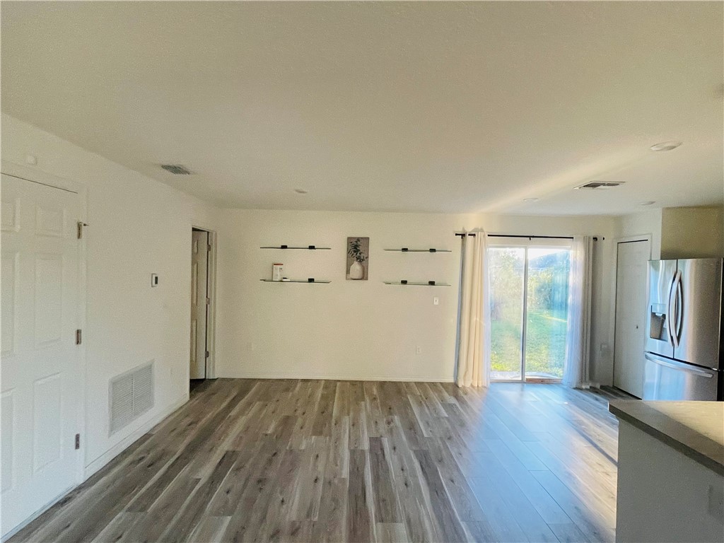 1281 Barber Street Sebastian, FL 32958 - Photo 5 of 26 a view of empty room with wooden floor