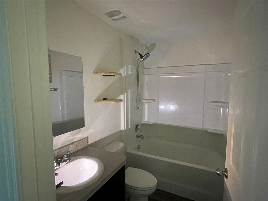 1281 Barber Street Sebastian, FL 32958 - Photo 8 of 26 a bathroom with a sink a toilet and shower