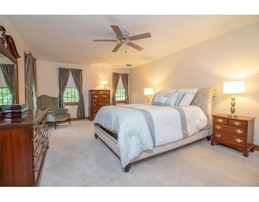 53 Fox Den Road Kingston, MA 02364 - Photo 16 of 30 a bedroom with a bed couch and window