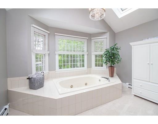 53 Fox Den Road Kingston, MA 02364 - Photo 17 of 30 a white bath tub sitting in a bathroom next to a window