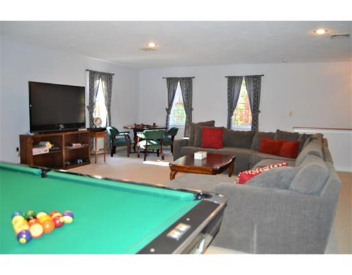 53 Fox Den Road Kingston, MA 02364 - Photo 24 of 30 a living room with furniture and a flat screen tv