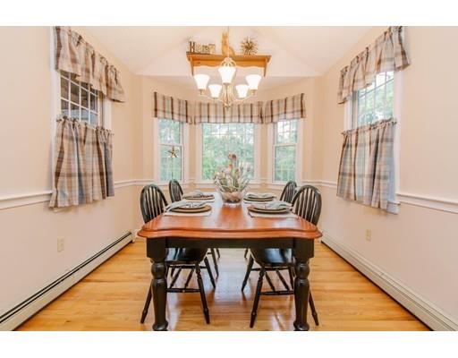 53 Fox Den Road Kingston, MA 02364 - Photo 6 of 30 a view of a dining room with furniture and a large window