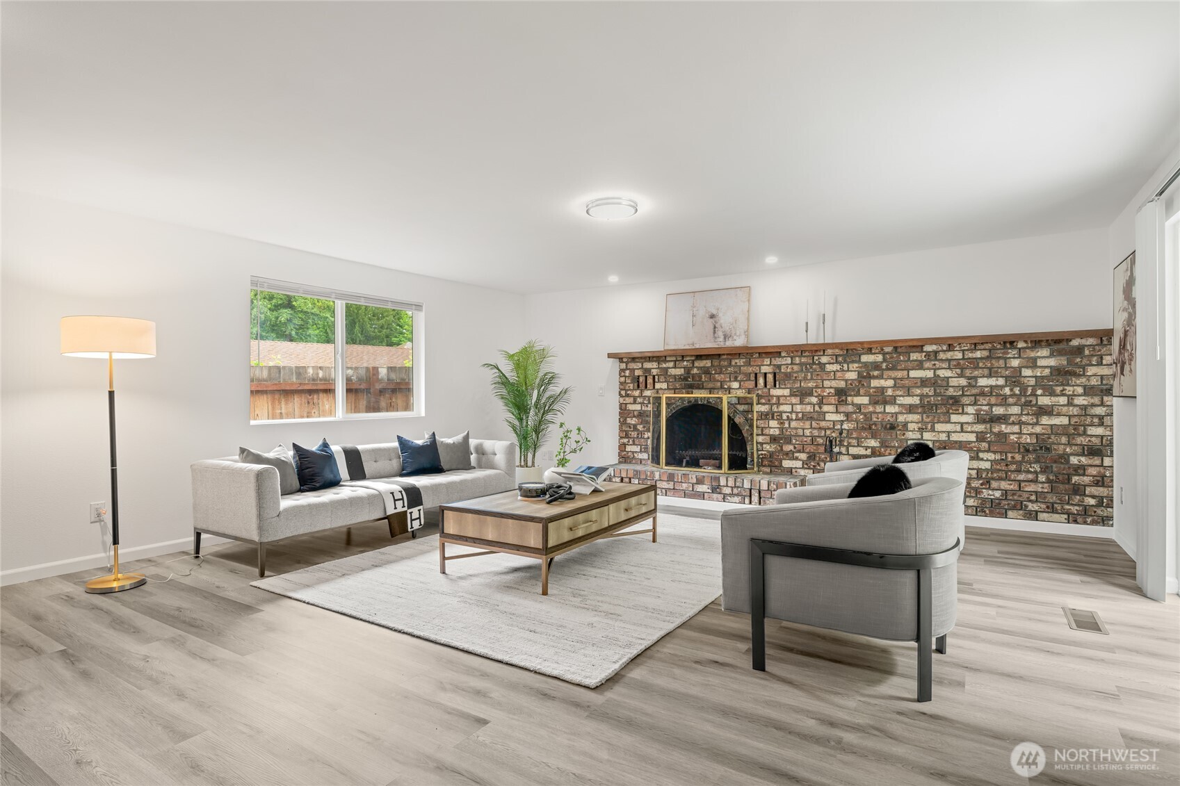 16809 Southeast 149th Street Renton, WA 98059 - Photo 14 of 30 a living room with furniture and a fireplace
