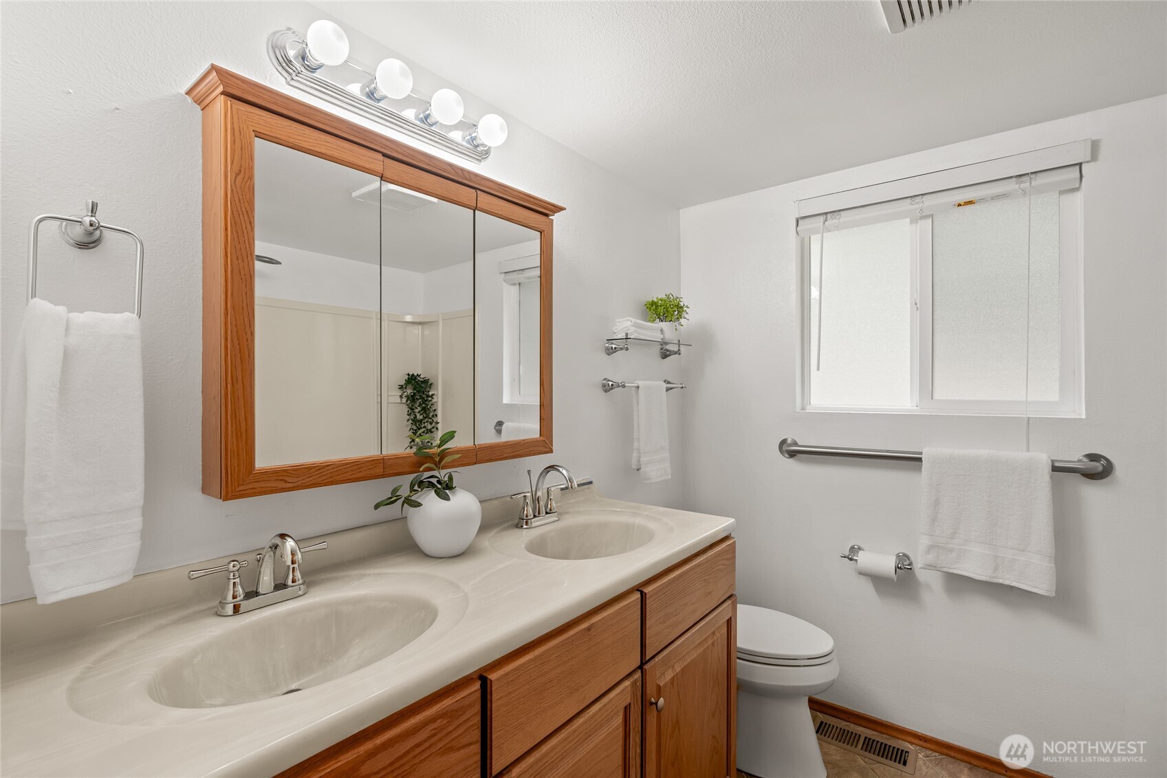 16809 Southeast 149th Street Renton, WA 98059 - Photo 16 of 30 a bathroom with a sink vanity granite and toilet