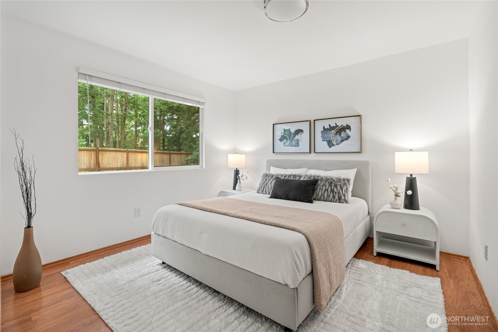 16809 Southeast 149th Street Renton, WA 98059 - Photo 17 of 30 a bedroom with a large bed and a window