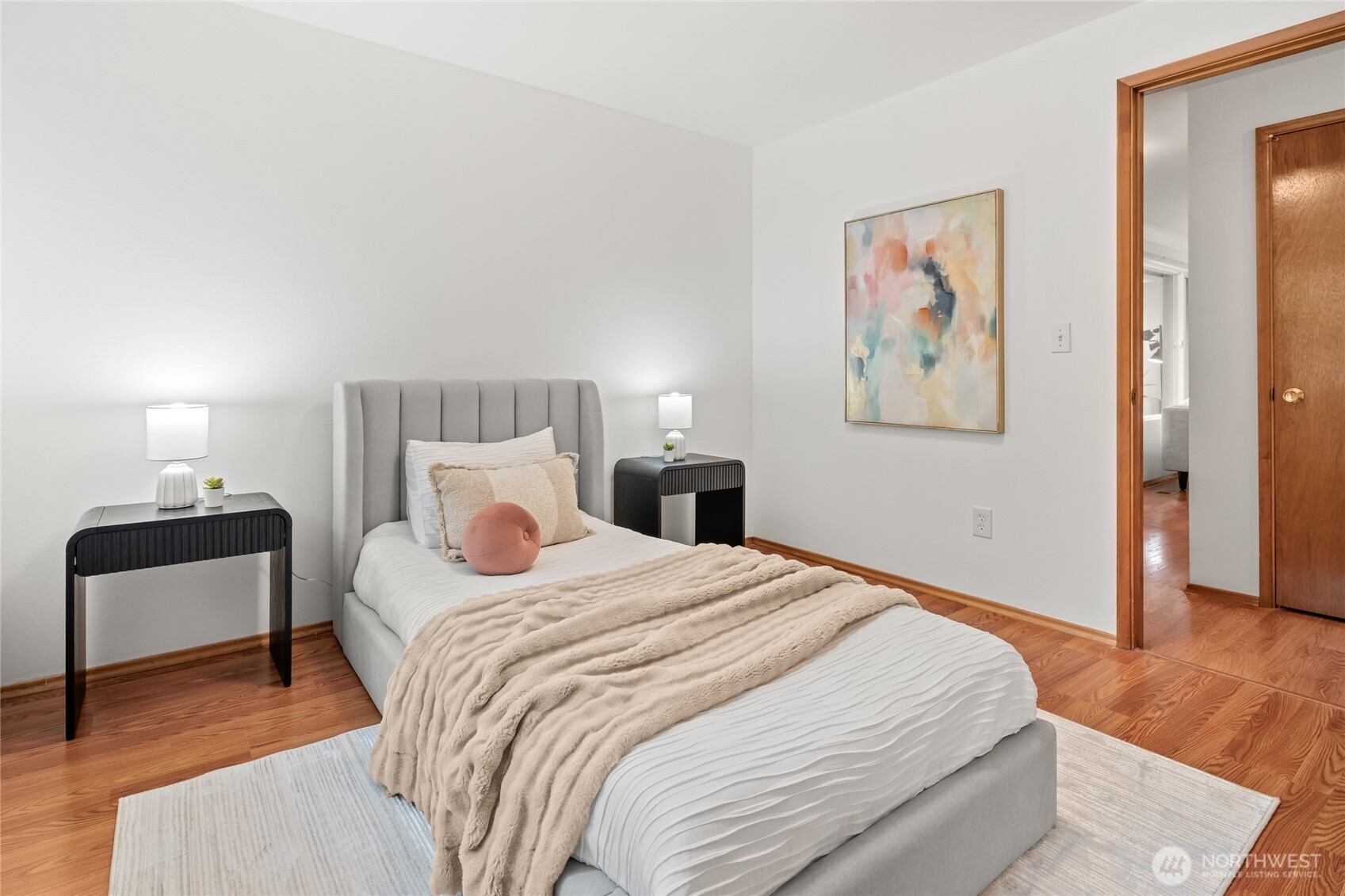 16809 Southeast 149th Street Renton, WA 98059 - Photo 20 of 30 a bedroom with a bed and a lamp