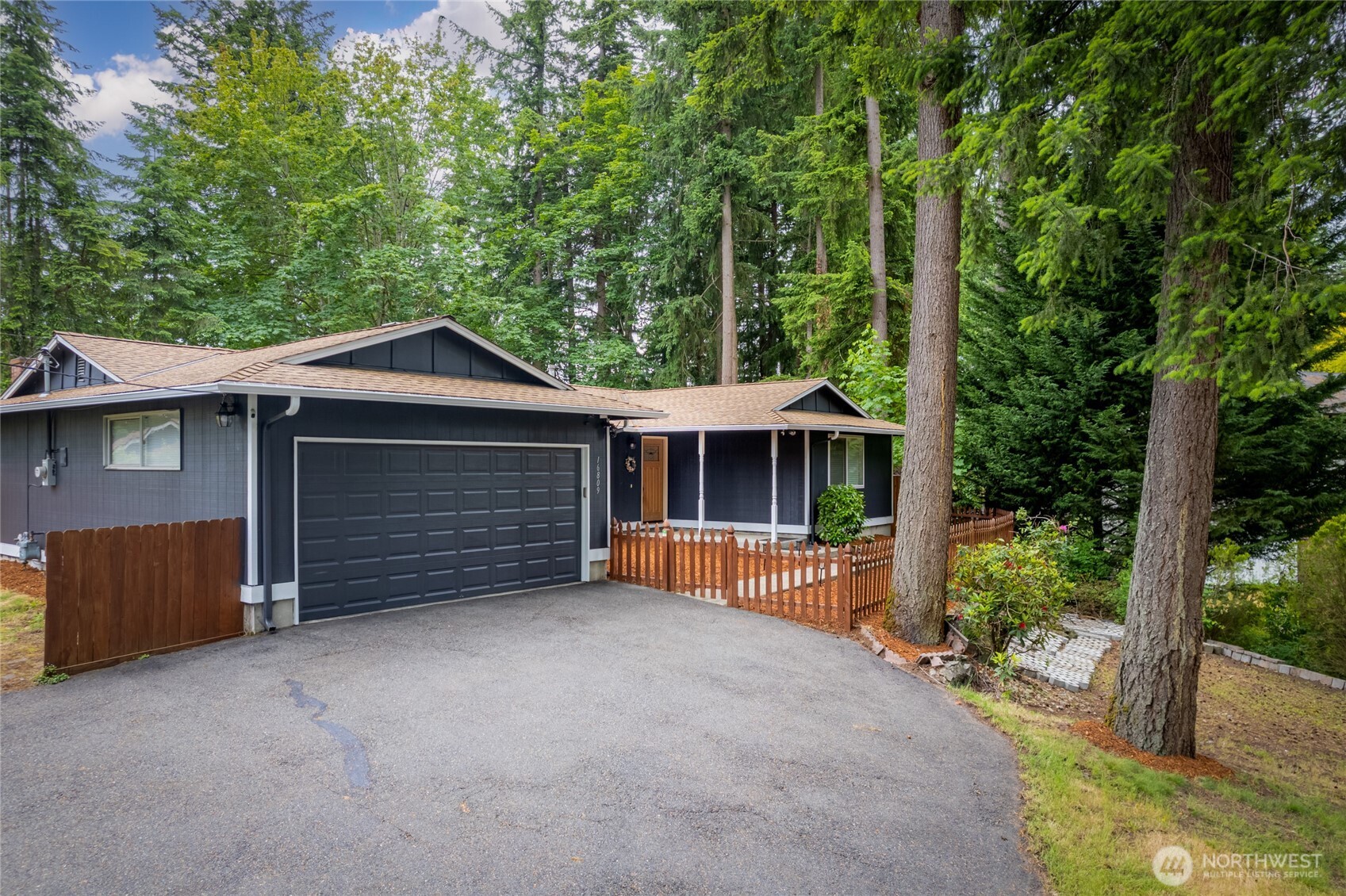 16809 Southeast 149th Street Renton, WA 98059 - Photo 2 of 30 a view of a house with a yard and garage