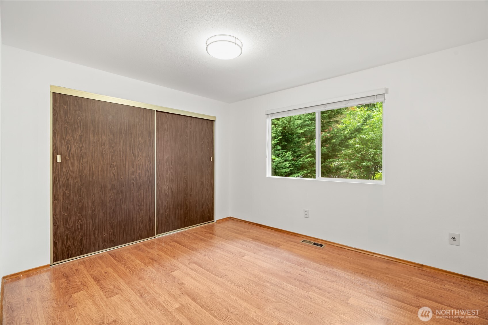 16809 Southeast 149th Street Renton, WA 98059 - Photo 21 of 30 a view of empty room with wooden floor and fan