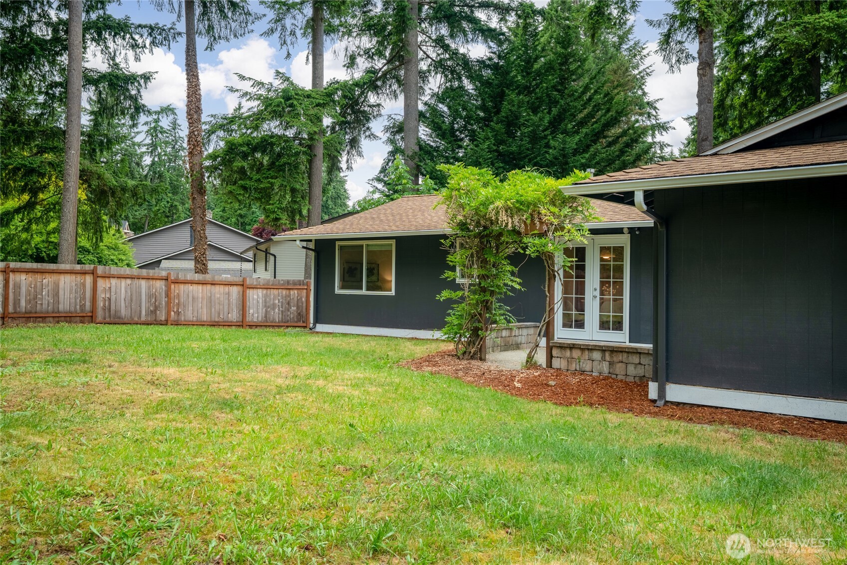 16809 Southeast 149th Street Renton, WA 98059 - Photo 26 of 30 a view of a house with a yard and sitting area