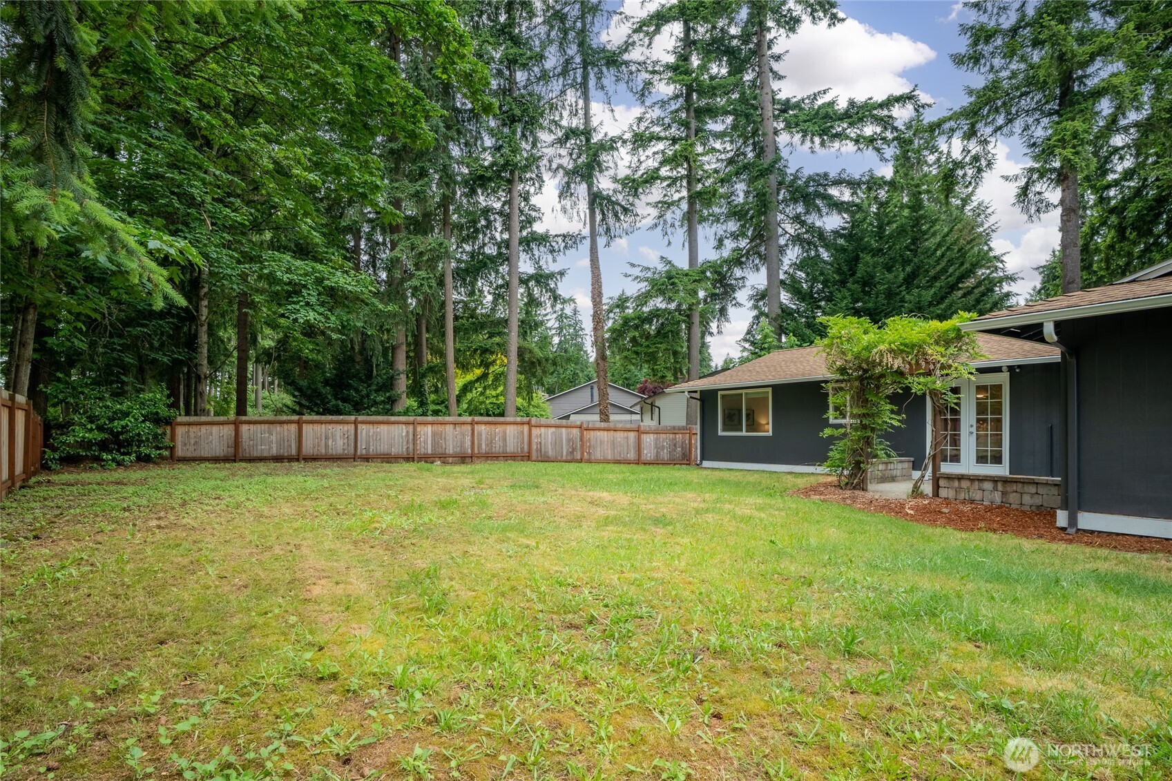 16809 Southeast 149th Street Renton, WA 98059 - Photo 27 of 30 a backyard of a house with table and chairs
