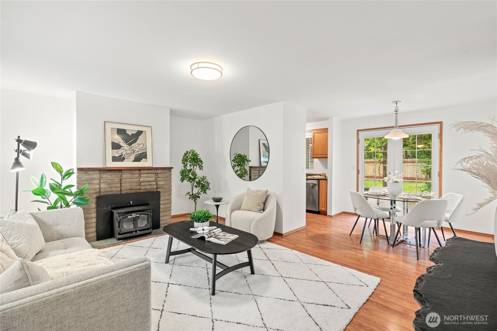 16809 Southeast 149th Street Renton, WA 98059 - Photo 4 of 30 a living room with furniture a fireplace and a table