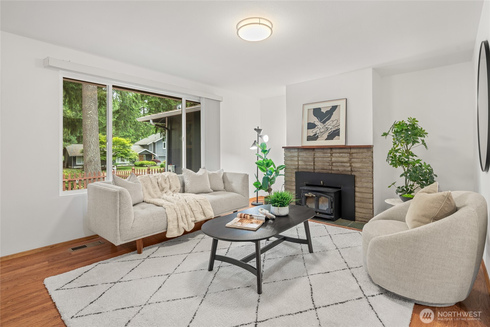 16809 Southeast 149th Street Renton, WA 98059 - Photo 5 of 30 a living room with furniture and a fireplace