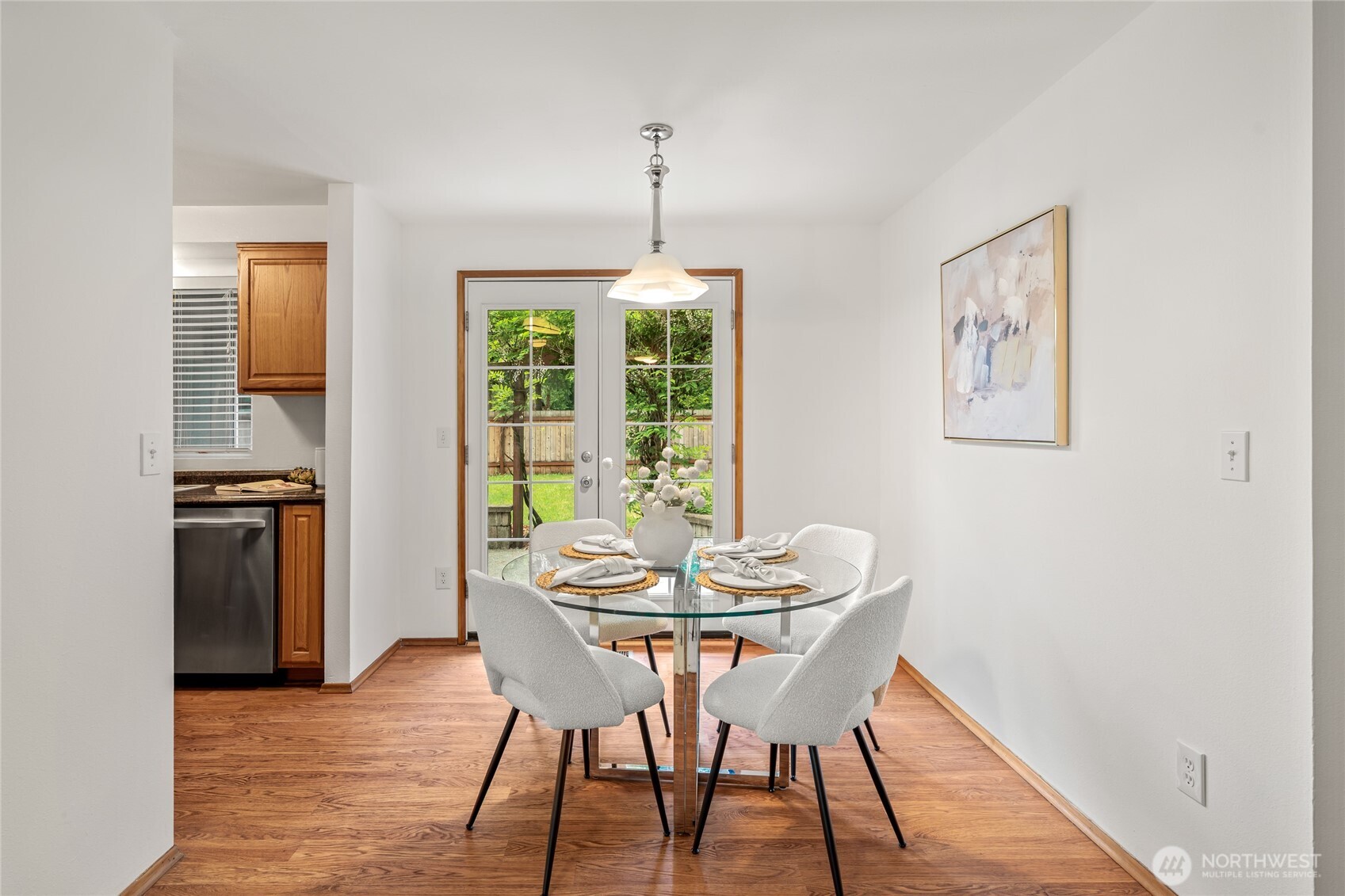 16809 Southeast 149th Street Renton, WA 98059 - Photo 6 of 30 a dining room with furniture window and wooden floor