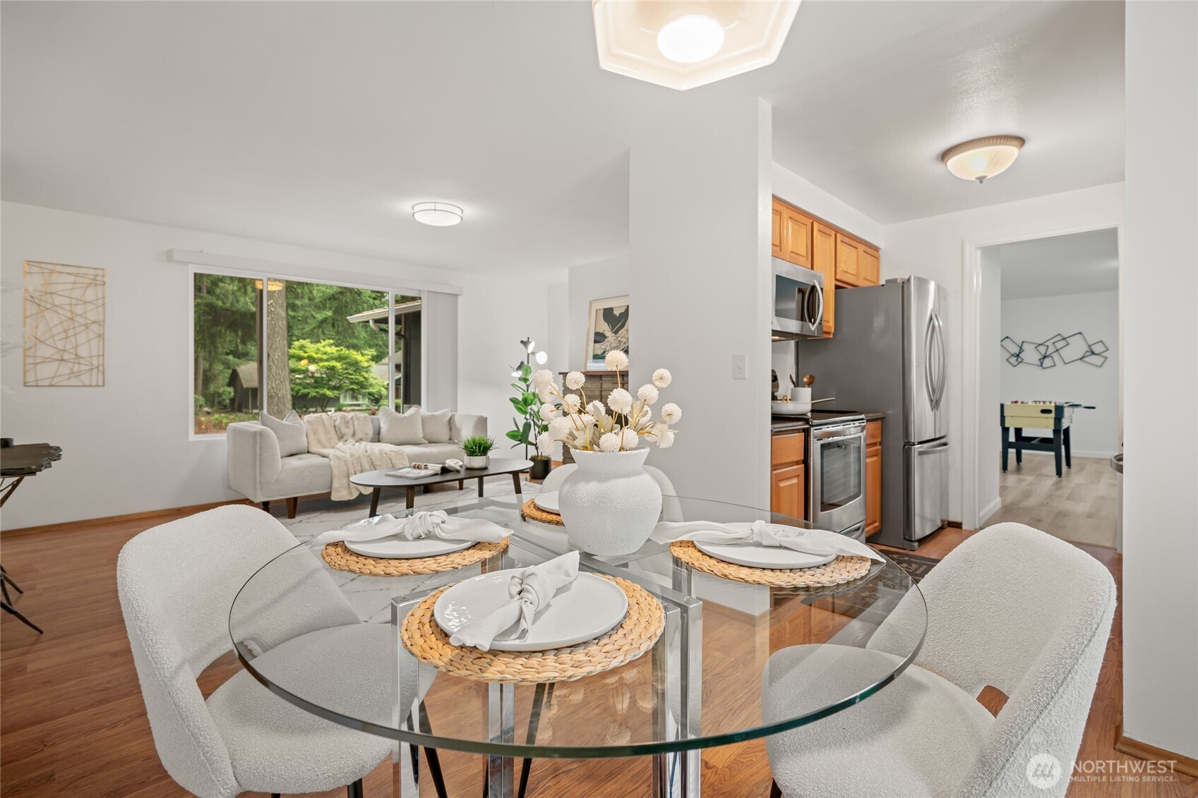 16809 Southeast 149th Street Renton, WA 98059 - Photo 9 of 30 a dining room with furniture a window and wooden floor