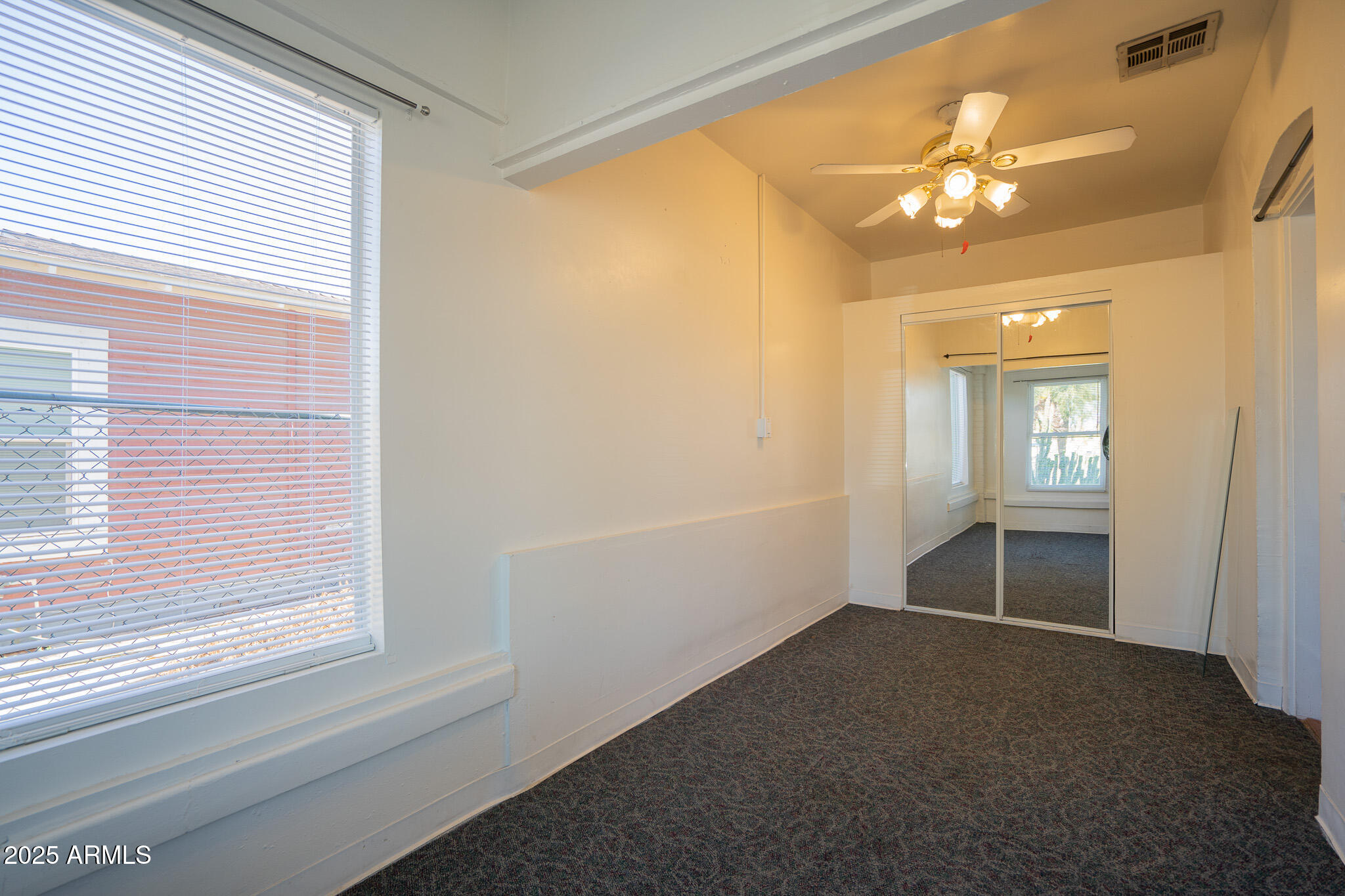 1001 East Garfield Street Phoenix, AZ 85006 - Photo 12 of 27 a view of an empty room with a window